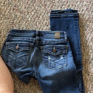 BKE Women's Skinny Jeans in Dark Blue Wash with Subtle Distressing